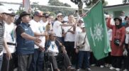 ‎Kegiatan semarak Jalan Sehat dalam rangka Milad ke-113 Muhammadiyah, yang dilaksanakan di Lapangan Makorem 062/Tarumanegara, Kecamatan Garut Kota, Kabupaten Garut, Minggu (14/12/2025).